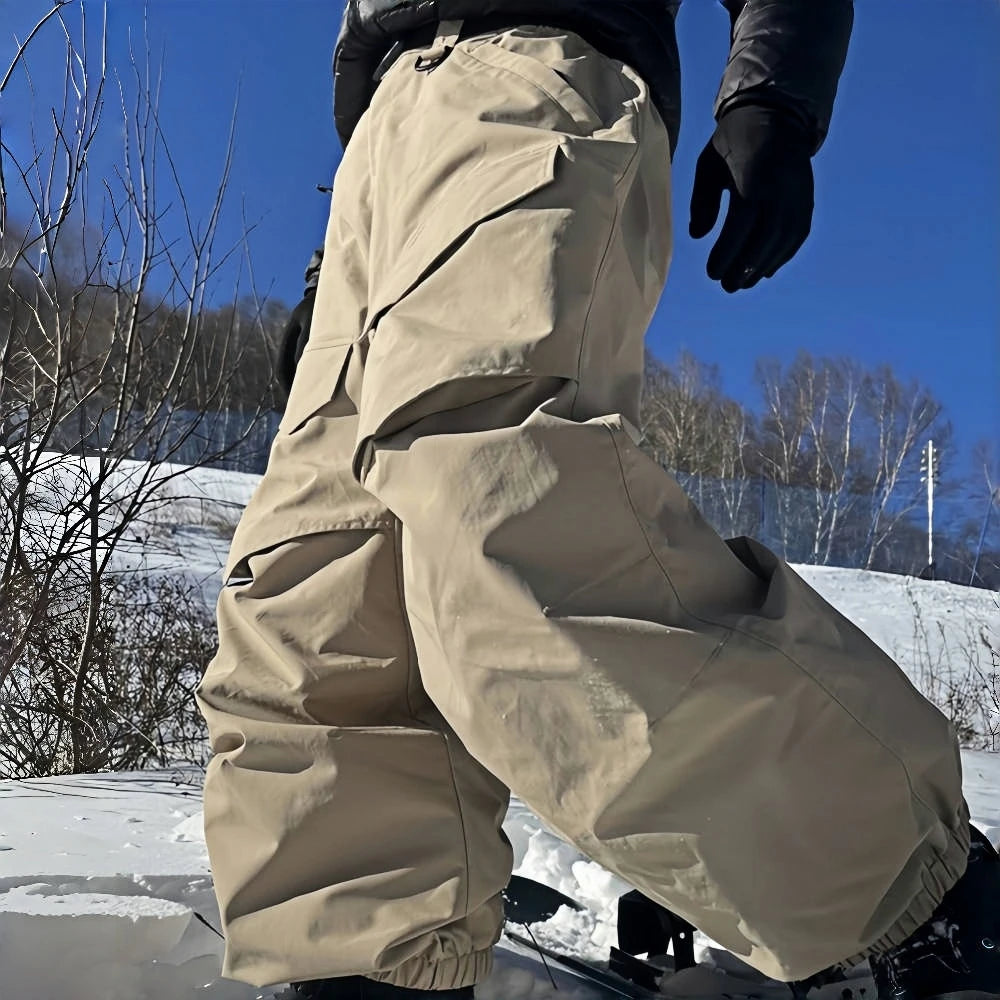 Men Baggy Wear-resistant Skiing Pants Women Insulated Loose Pockets Winter Trousers Outdoor Sports Waterproof Clothes 2025 Warm